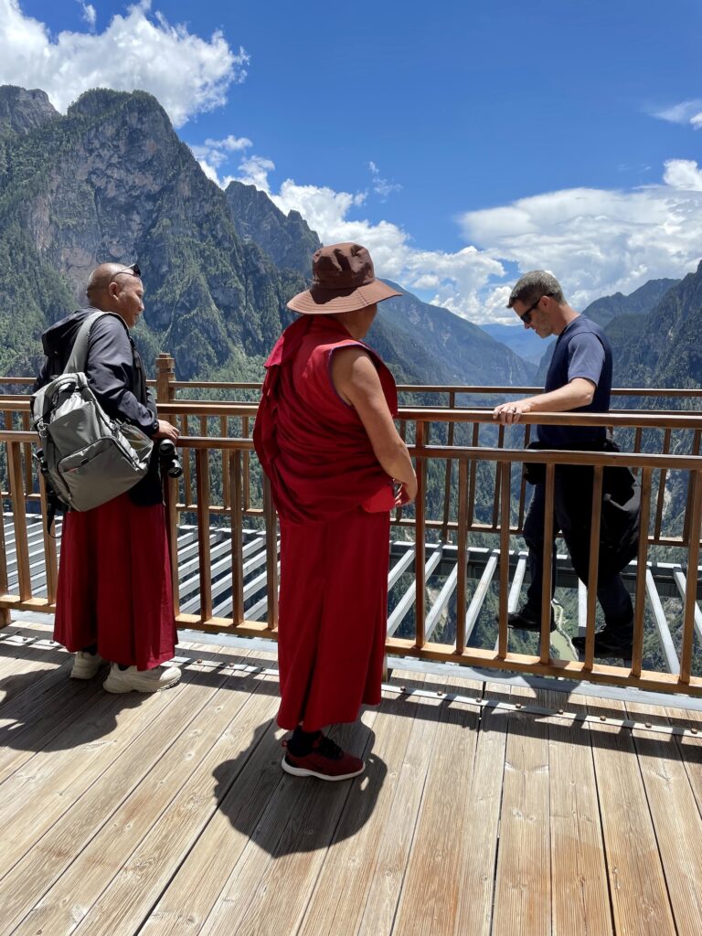 Walking in front of Tibetan Buddhist monks on 