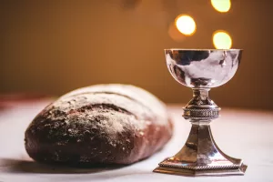 A photo of bread and a cup to show the elements of Holy Communion. 